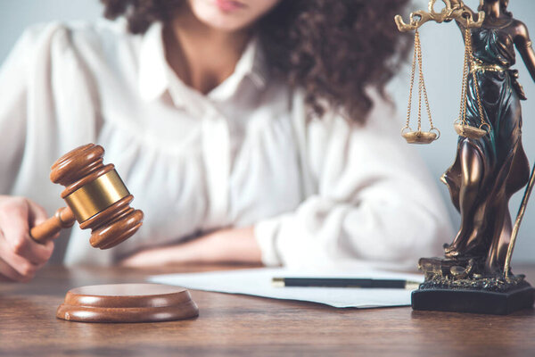 woman hand wooden judge on the desk