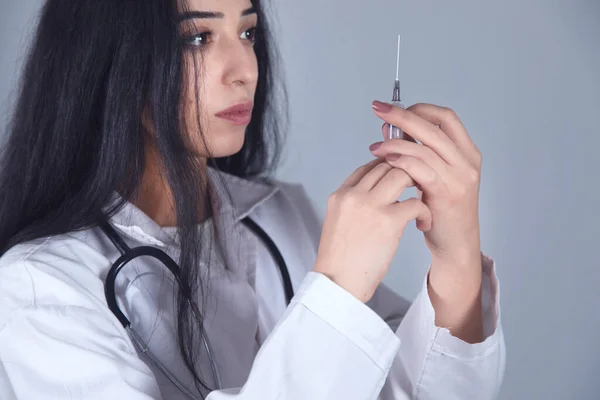 Doctor Hand Holding Syringe Grey Background — Stock Photo, Image