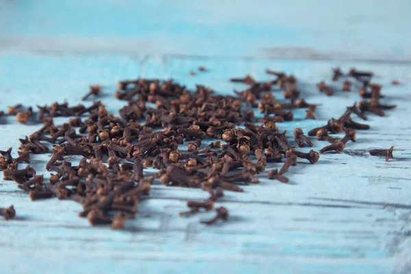cloves on the blue and vintage table background