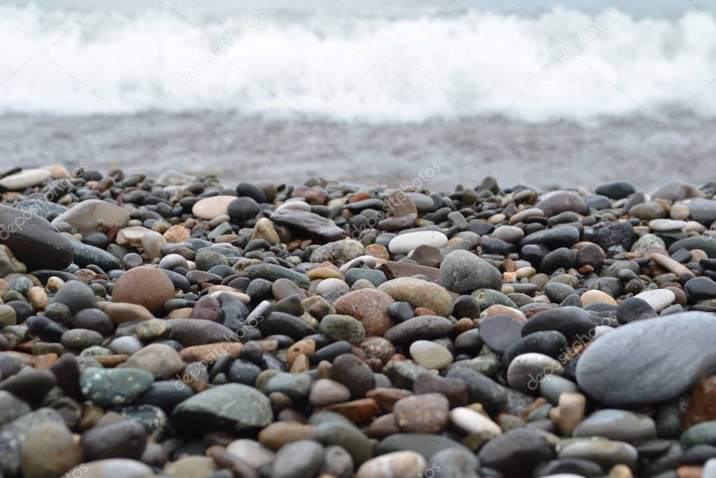 Pebbles on the beach on a cloudy day