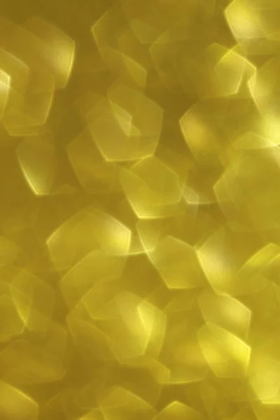 Fondo abstracto dorado brillante con un efecto bokeh — Foto de Stock
