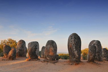 Megaliths of Cromlech of Almendres, Alentejo, Portugal. clipart