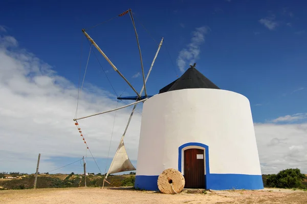 Traditional portuguese windmill near Odeceixe Aljezur, Portugal. Stock Photo
