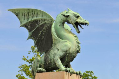 Slovenia, Ljubljana, Bronze dragon on the dragon bridge, Ljubljana. clipart