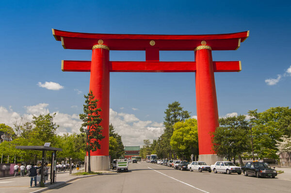 Red torii of Heian Jingu Shrine under the blue sky in Kyoto Japan.