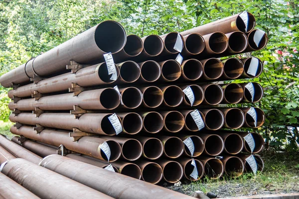 long rusted steel pipes stacked for gas pipes