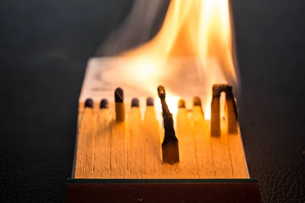 Matchstick letter with matches and flame — Stock Photo, Image
