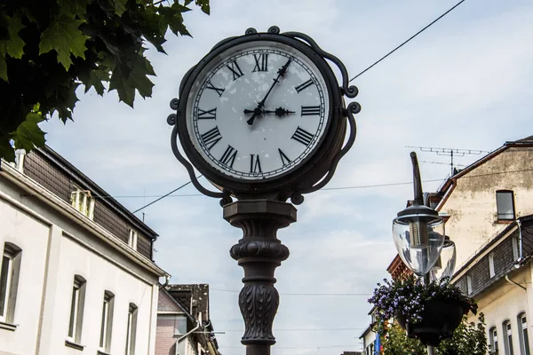 antique grandfather clock in pedestrian zone