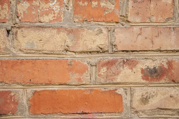 old crumbling abandoned brick wall.