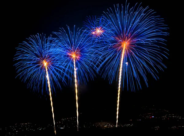 Blue fireworks in the night sky — Stock Photo, Image