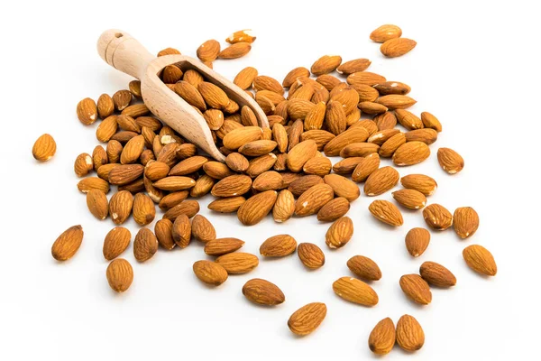 Almond nuts on wooden spoon. — Stock Photo, Image