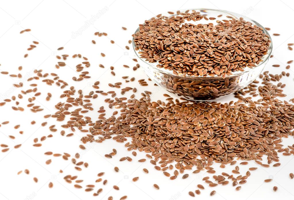 Flax seeds in transparent bowl.