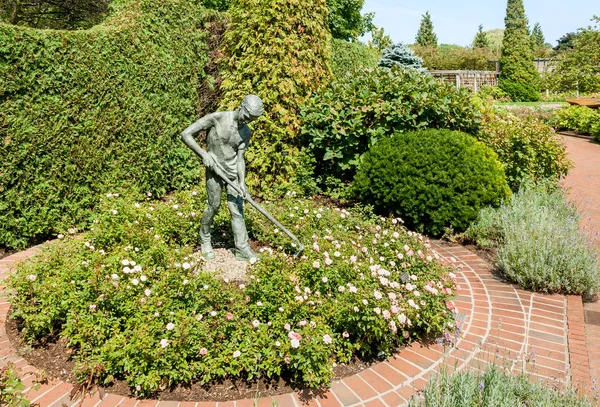 Zahradník bronzová socha chlapce v Chicagu Botanic Garden, Usa — Stock fotografie