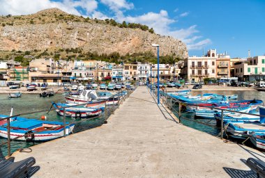 Small port with fishing boats in the center of Mondello. clipart