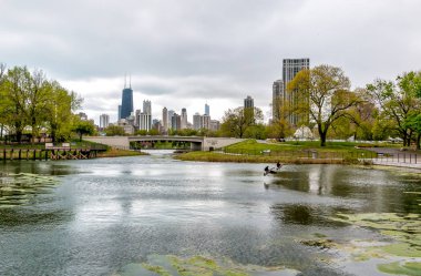 Chicago skyline with skyscrapers viewed from Lincoln Park Zoo over lake, USA clipart