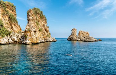 Landscape of Mediterranean sea with Faraglioni of Scopello at Zingaro Nature Reserve, Sicily, Italy clipart