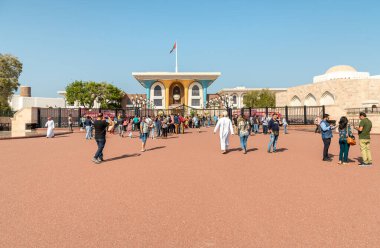 Muscat, Oman - February 10, 2020: Tourists visiting the Al Alam Palace, one of six sultanic residences, located in Old Muscat in Sultanate of Oman.