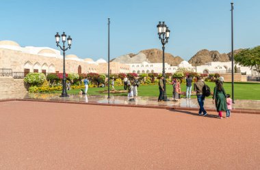 Muscat, Oman - February 10, 2020: Tourists visiting the Al Alam Palace, one of six sultanic residences, located in Old Muscat in Sultanate of Oman.