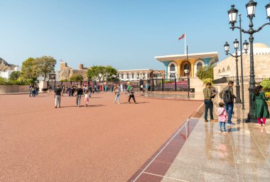 Muscat, Oman - February 10, 2020: Tourists visiting the Al Alam Palace, one of six sultanic residences, located in Old Muscat in Sultanate of Oman.
