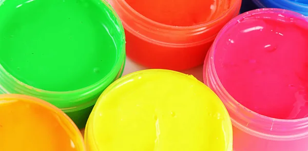 Children's colorful finger paints in jars — Stock Photo, Image
