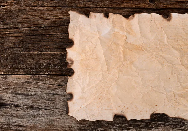 Old crushed paper with the burned edges