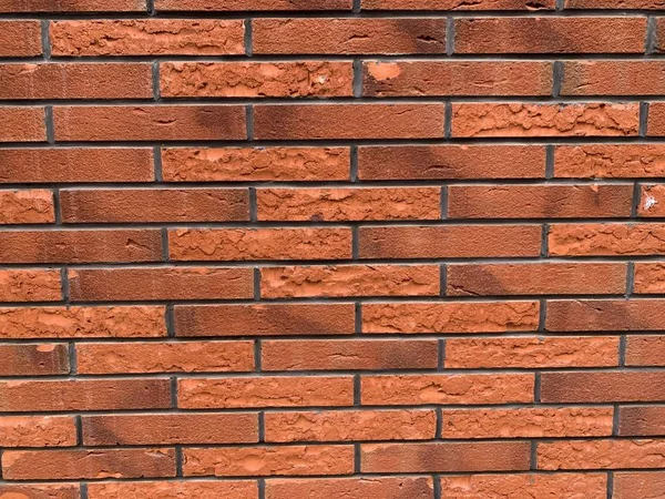 Textura de ladrillo. Ladrillos gruesos pared con ladrillos rojos para el fondo — Foto de Stock