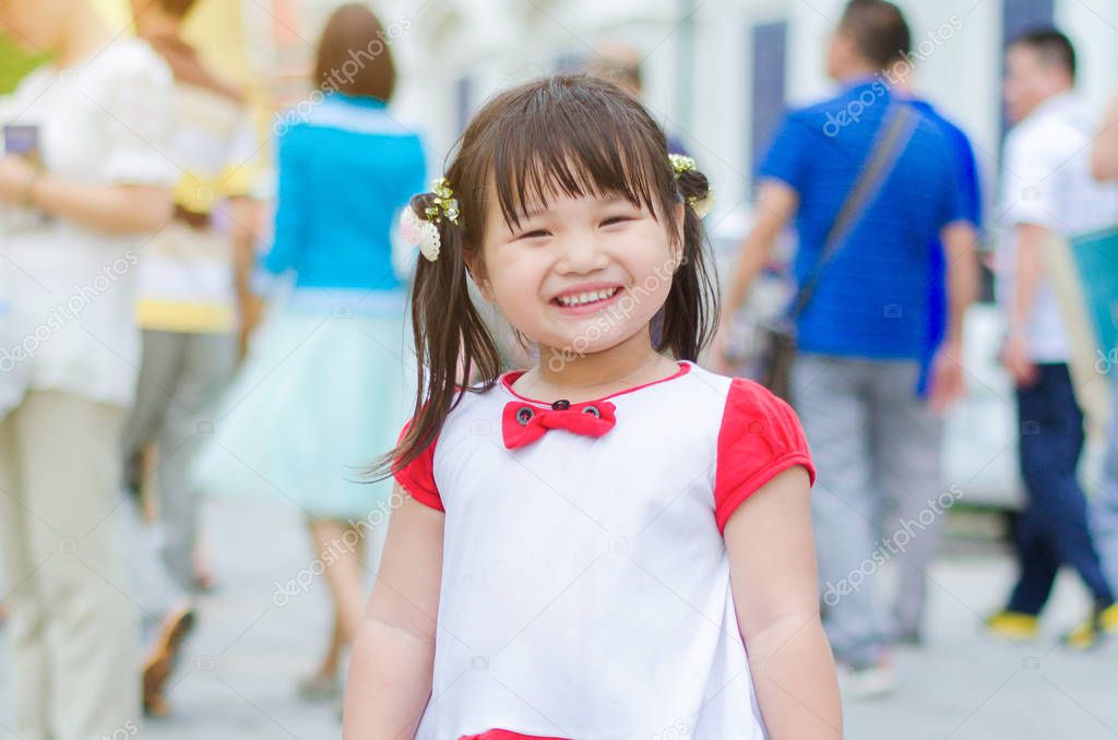 Medium shot Smile is sincere from little girl white shirt and re