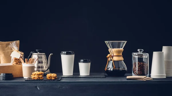 Coffee shop interior, Coffee to go and accessories on the table