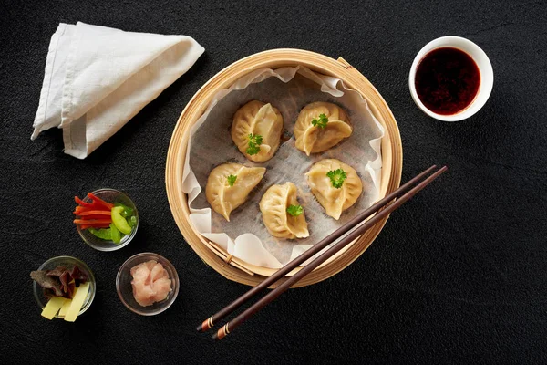 Dim sum dumplings in steamer and ingredients top view — Stock Photo, Image