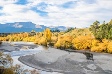 Beautiful view from the Historic Bridge over Shotover River in Arrowtown, New Zealand. clipart