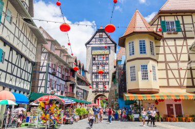 Bukit Tinggi, Malaysia - Feb 25,2018 : People can seen exploring the Colmar Tropicale,Bukit Tinggi Resort.This French-themed resort, situated in Bukit Tinggi,rests upon 80 acres of verdant forestland clipart