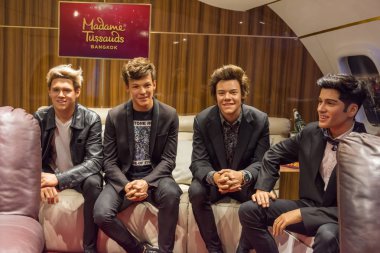 Members of the boy band One Direction wax figure display at Madame Tussauds Museum,Siam Discovery in Bangkok Thailand.