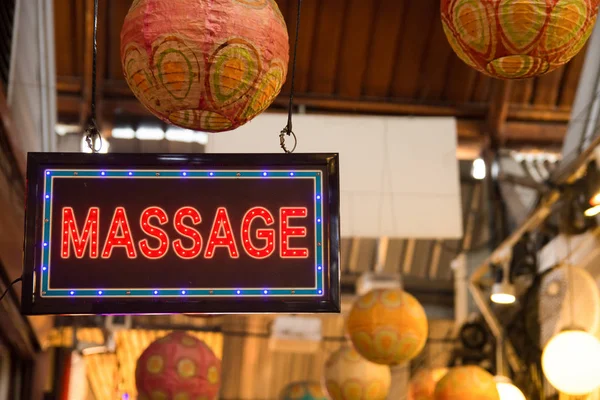 Red LED massage signage hanging at the Chatuchak weekend market,Bangkok Thailand.