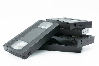Stack of VHS video tape cassette isolated on white background. clipart