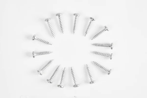 Top view of the circle of screws, isolated on a white background.