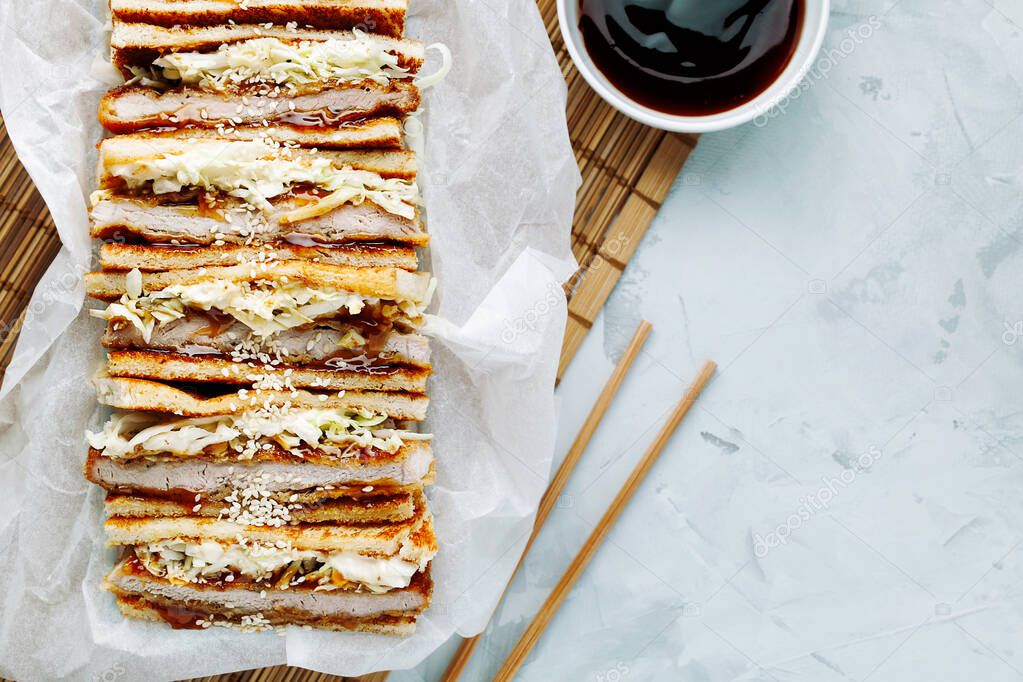 Katsu Sando Japanese Cutlet Sandwich With Deep Fried Pork Cabbage Mayonnaise And Tonkatsu Sauce On A Light Background With Copy Space Food Trend Asian Cuisine Food Japanese Fast Food Top View Flat Lay 334284912 Larastock