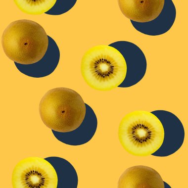 Modern kivi yaratıcı tropikal desen pop-art tarzında koyu sarı veya turuncu arkaplan. Soyut gıda meyve sanatı arka planı. Minimum baskı kavramı.