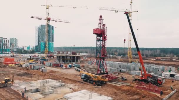 Construction machinery is building apartment residential area. — Stock Video