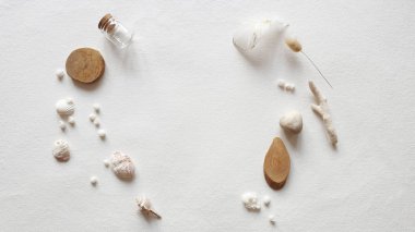 Blank white Wedding invitation card mockup craft envelope, textured table background. Tropical Sea shell, corals, light stone, wooden slice, paper sheet. Template. Vacation memories Flat lay, top view