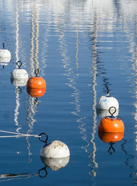 Mirroring buoys in yacht harbor — Stock Photo, Image