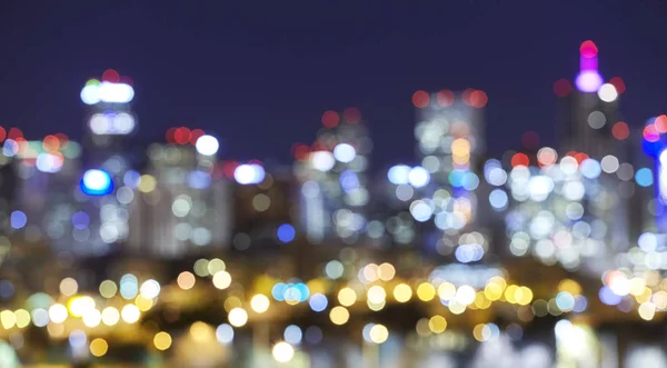 Verschwommene Skyline Stadt Lichter in der Nacht. — Stockfoto