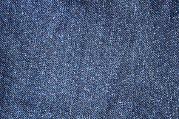 Fechar fundo tecido jeans azul ou textura — Fotografia de Stock