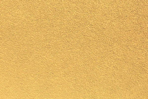 Yellow rugged plaster wall, texture or background — Stock Photo, Image