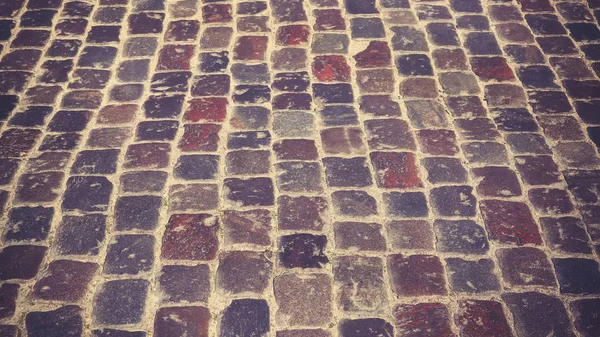 Cor tonificada rua de paralelepípedo velho, fundo ou textura — Fotografia de Stock