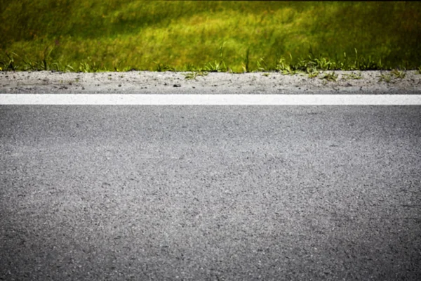 Bir yol asfalt, kavramsal arka plan bulanık resim — Stok fotoğraf