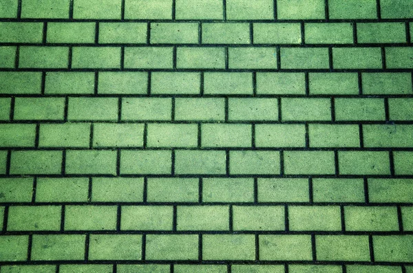 Green color brick pavement textured background — Stock Photo, Image