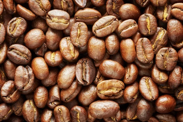 Pražená kávová zrna, přirozené potravy pozadí — Stock fotografie