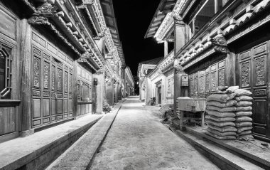 Illuminated empty street of Shangri La at night, China. clipart