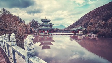 Vintage toned picture of Jade Spring Park, Lijiang, China clipart