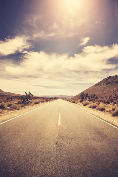 Vintage stylized picture of a road at sunset, USA. — Stock Photo, Image